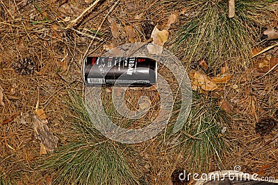 Rubbish in nature. Nature pollution of a tin beer can Editorial Stock Photo