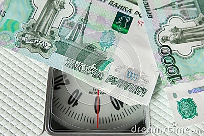 Rubble banknotes on the on the scales Stock Photo