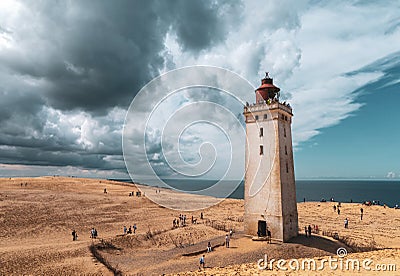 Rubjerg Knude Lighthouse on the coast of the North Sea in the Jutland in northern Denmark. Natural landscape with sand Editorial Stock Photo