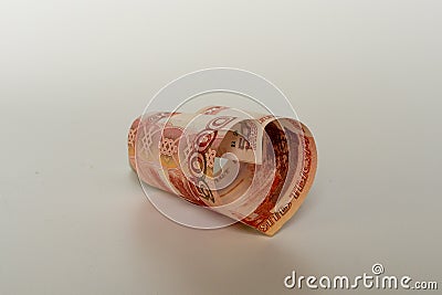 5000 rubles. Red bill 5 thousand rubles in the shape of a heart on a white background. Concept of money, love and a gift for Stock Photo