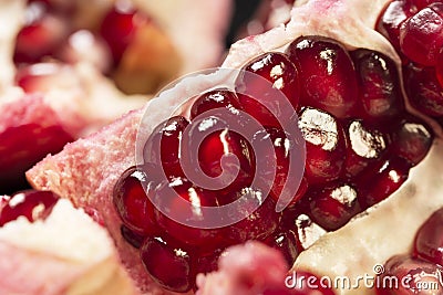 Ruby juicy pomegranate grains closeup Stock Photo