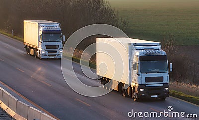 Ruck with container on highway, cargo transportation concept Stock Photo