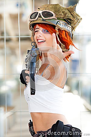 Rude defiant army girl. Military woman with gun. Stock Photo