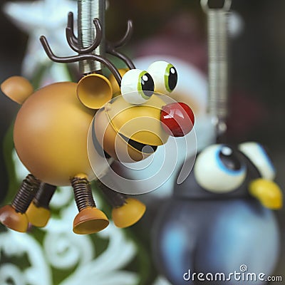 A Rudolph the Red Nosed Reindeer Ornament with a Penguin Stock Photo