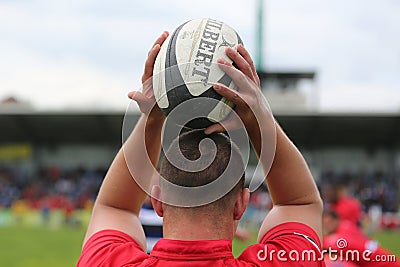 Rugby ball in hands Editorial Stock Photo