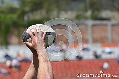 Rugby ball in hands Editorial Stock Photo
