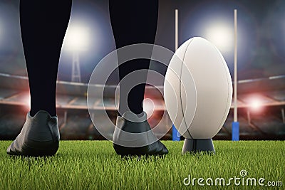 Rugby ball with rugby posts on field Stock Photo