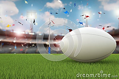 Rugby ball with rugby posts on field Stock Photo