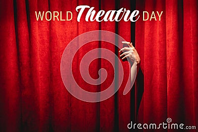 World theatre day background with text on top. March 27. The hand on the red curtain background. Stock Photo