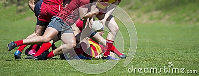 Rugby players fight for the ball on professional rugby stadium Stock Photo