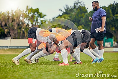 Rugby, scrum or men training with coach on grass field ready for match, practice or sports game. Fitness, performance or Stock Photo