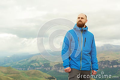 Rugged bearded man in in a membrane jacket headshot country masculine midwest mountain male Stock Photo