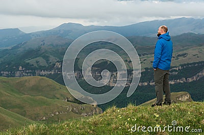 Rugged bearded man in in a membrane jacket headshot country masculine midwest mountain male Stock Photo