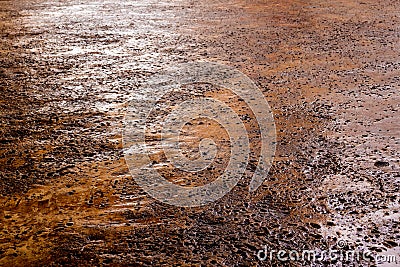 Rugged holes on the rusty color concrete floor Stock Photo