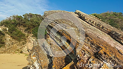 rugged rocks at Quarry Beach near Mallacoota Stock Photo