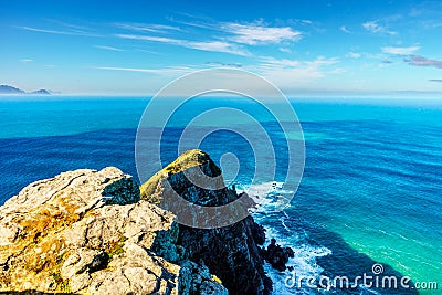 Rugged rocks and steep cliffs of Cape Point in the Cape of Good Hope Nature Reserve Stock Photo