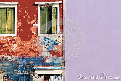 Rugged and smooth wall with crack wooden window on colorful cement background Stock Photo