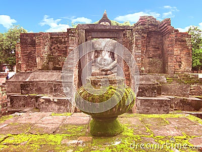 ruin of buddha statue behind the ruin Stock Photo