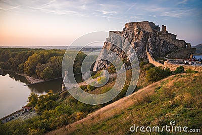 Ruin of a Castle on a Rock at Sunset Stock Photo