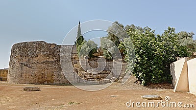 Ruin of a tower surrounded by trees in Italica, Roman city in the province of Hispania Baetica Stock Photo