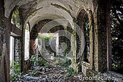 Ruined abandoned overgrown interior of abandoned mansion, Abkhazia, Georgia Stock Photo