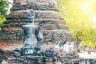 A ruined buddha statue remains of Buddha image at Wat Phra Si Sanphet. The old Buddhism ruins in Ayutthaya, Thailand, Stock Photo