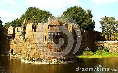 Giant battlement of vellore fort with trees and trench Stock Photo