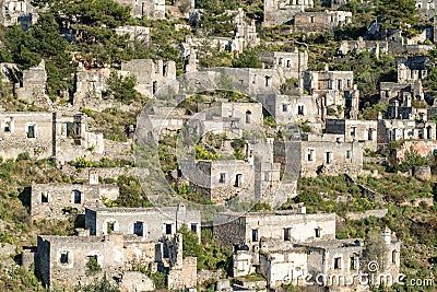 Ruined houses of Kayakoy (Levissi) abandoned village near Fethiye in Mugla province of Turkey Stock Photo