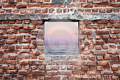 Ruined old brick wall window with sunset sky and sea view. Freedom, dream, imagination or isolation Stock Photo