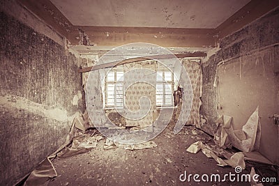 Ruinous empty room with old wallpapers Stock Photo