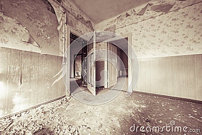 Ruinous empty room with old wallpapers Stock Photo