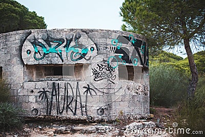 Ruins of an Abandoned and Vandalized Round Shelter with two Rectangular Windows in the South of Spain Editorial Stock Photo