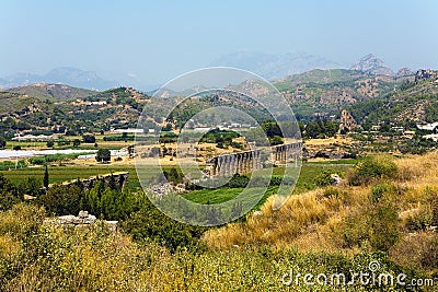The ruins of an ancient aqueduct near the town of Aspendos Stock Photo