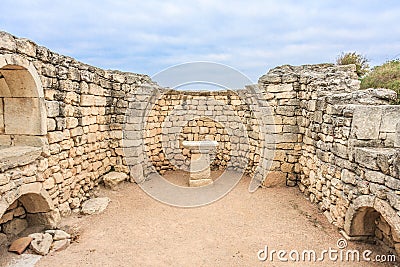 Altar in the ruins of ancient Greek city of Chersonesus Taurica in the Crimea peninsula under the cloudy sky, Sevastopol Stock Photo