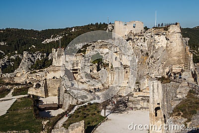 Ruins of the castle standing atop of picturesque village Editorial Stock Photo