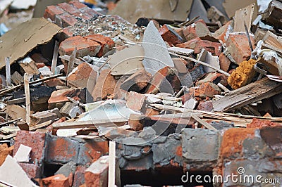 Ruins of a destroyed wooden house. Fragments of walls, boards, interior details. Stock Photo