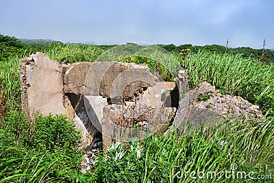 The ruins of the former gun emplacements in the bay of Akhlestyshev on the island of Russian. Russia, Vladivostok Stock Photo