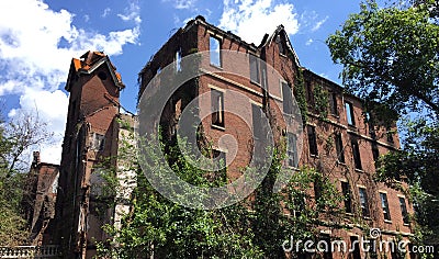 Ruins of large old fire damaged home Stock Photo
