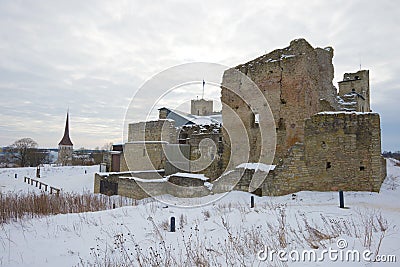 Ruins of the medieval castle of the Livonian knightly award close up in the cloudy March afternoon. Rakvere, Estonia Stock Photo