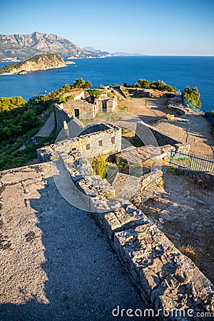Ruins of medieval fortress Tvrdava Mogren at the shore of Adriatic sea, Montenegro. Stock Photo