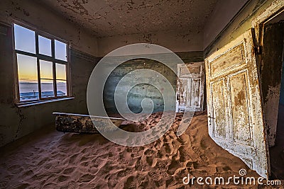 Ruins of the mining town Kolmanskop in the Namib desert near Luderitz in Namibia Stock Photo