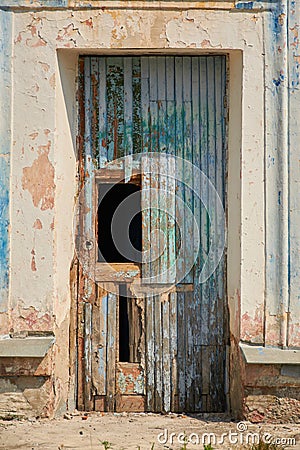 Ruins of an old school building in the city. The door of a dilapidated room. Stock Photo