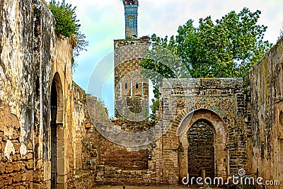 Ruins of the Roman city known as Sala Colonia and the Islamic complex of Chellah, mosque and minaret ruined Stock Photo