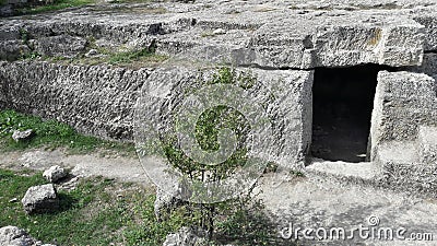 Ruins of a stone house artificial cave Stock Photo