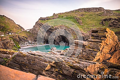 The ruins of Tintagel Castle on Tintagel Island at sunset Stock Photo