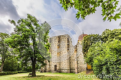 Ruins of the unfinished Gothic church of Virgin Mary from garden Editorial Stock Photo