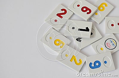 Rummy pieces randomly mixed on a white background. Free space for text. Rummy society boardgame Stock Photo