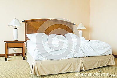 Rumple pillow on bed Stock Photo