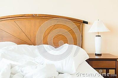Rumple pillow on bed Stock Photo
