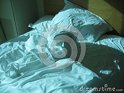 Rumpled bed Stock Photo